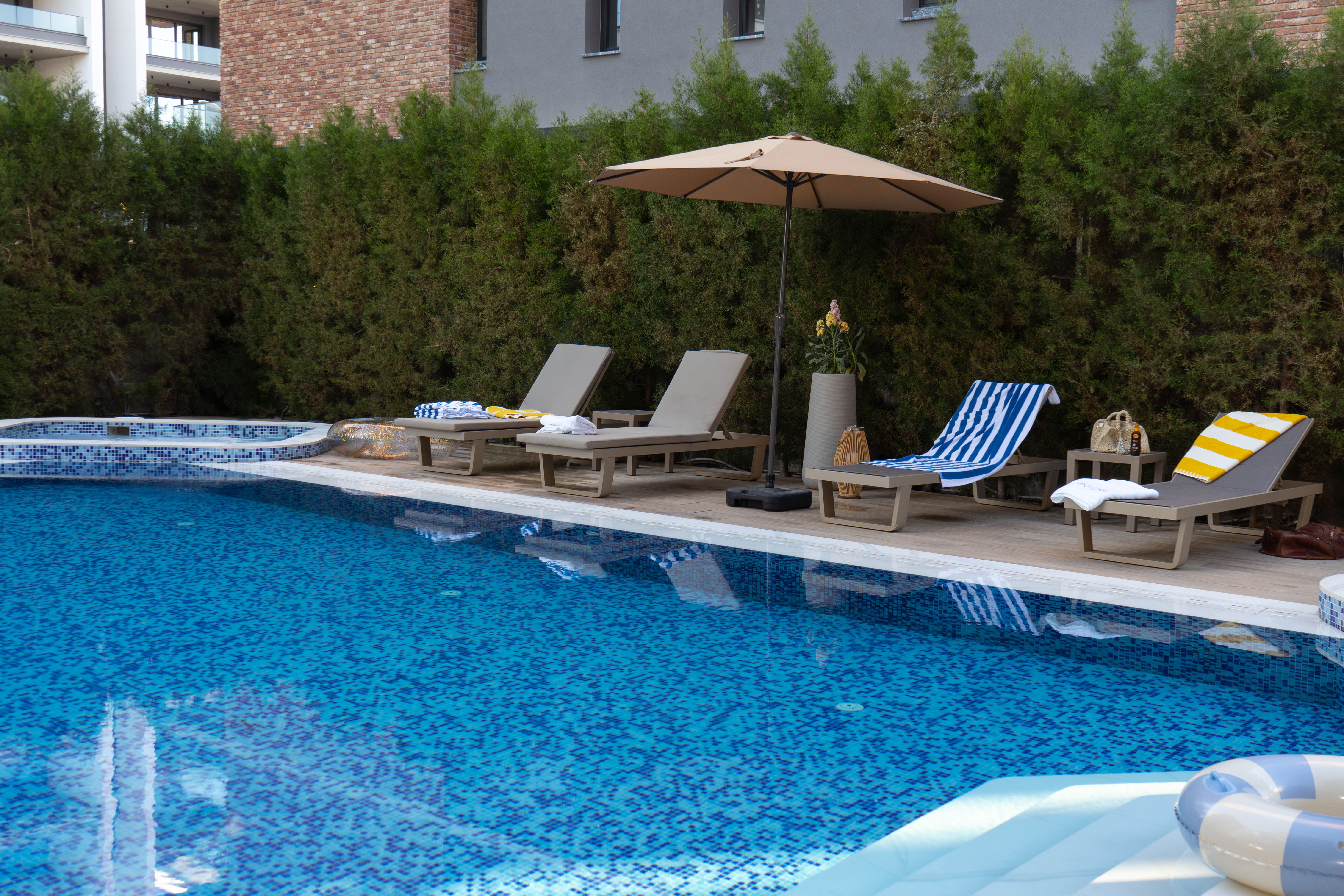 Sun loungers and umbrella on the pool deck