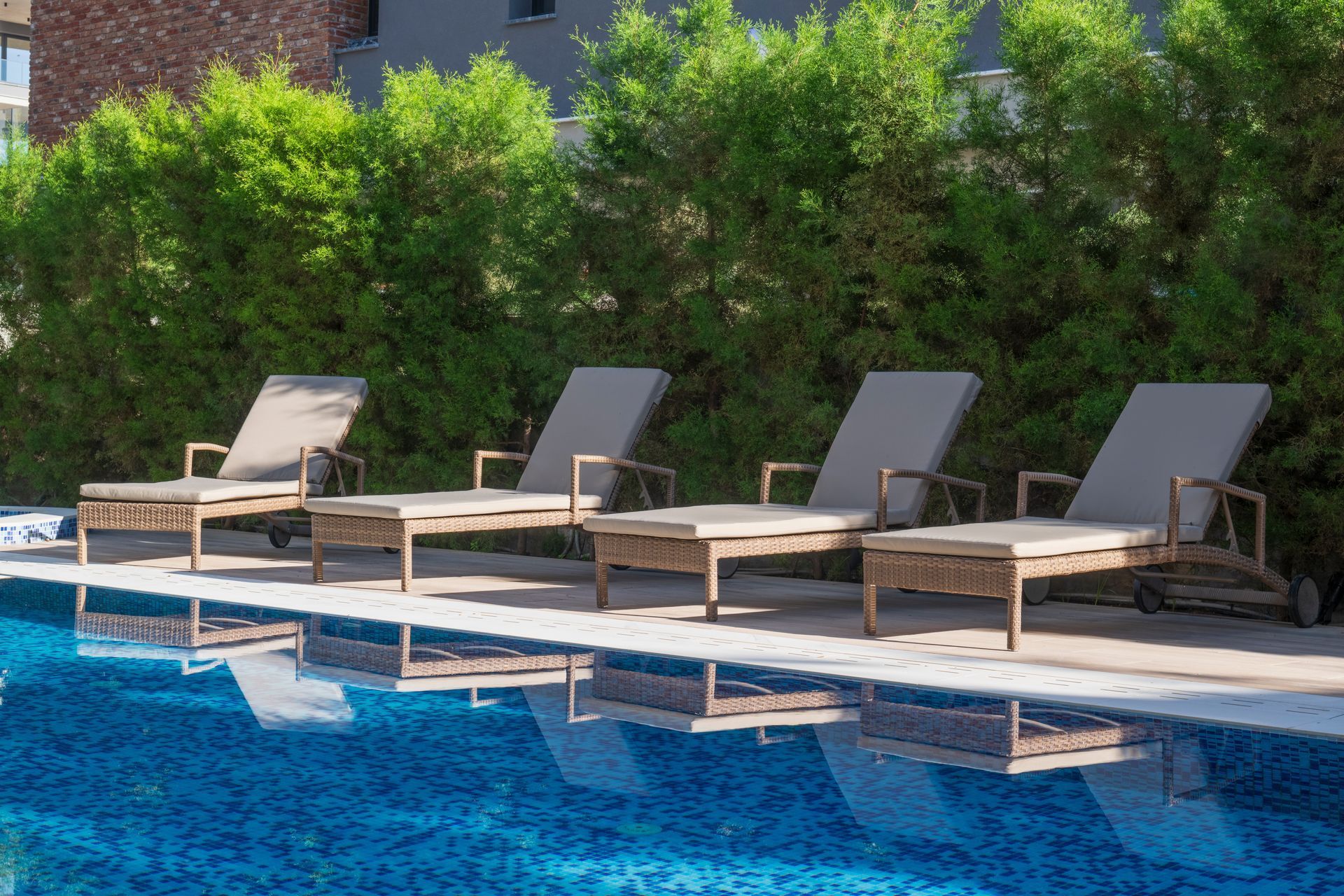 Pool area with lounge chairs